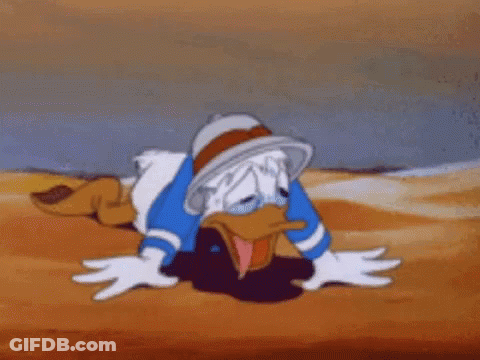 Donald Duck Is Crawling In The Sand With His Tongue Out . GIF