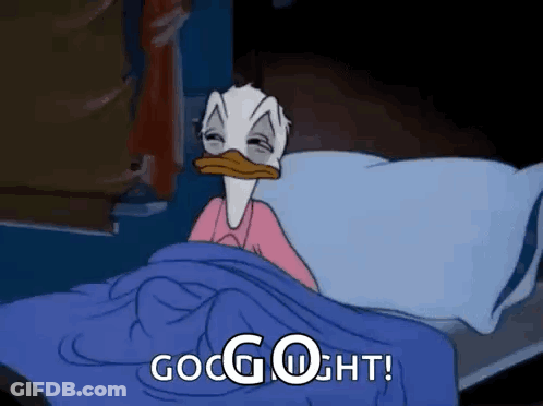 Donald Duck Is Laying In Bed With His Eyes Closed And The Words `` Good Night '' Written On It . GIF