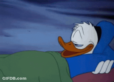 Donald Duck Is Sleeping On A Bed With His Eyes Closed . GIF