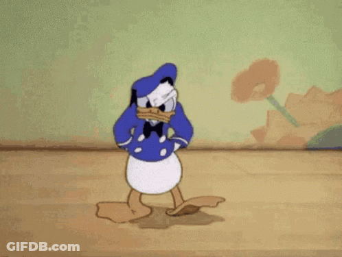 Donald Duck Is Standing On A Wooden Floor In A Room GIF