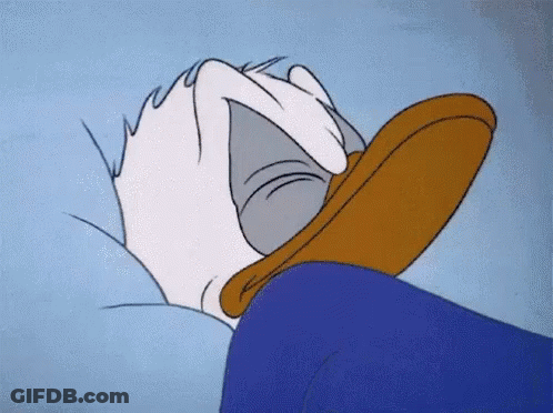 Donald Duck Laying On Bed With Head On Pillow GIF