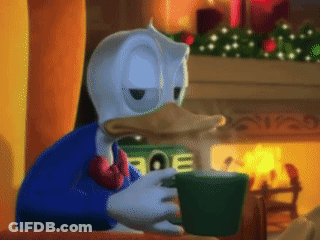 Donald Duck Sitting By Fireplace Drinking From Green Cup GIF