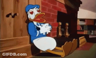 Donald Duck Sitting In Front Of Fireplace GIF