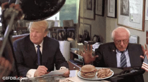 Donald Trump And Bernie Sanders Sitting At Table With Hamburger And Fries GIF