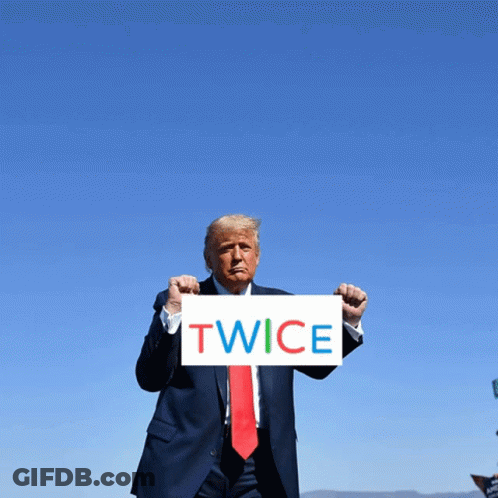 Donald Trump Holds Sign Saying Twice In Front Of Blue Sky GIF