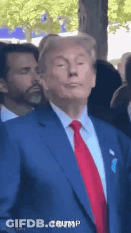 Donald Trump In Blue Suit And Red Tie Before Crowd GIF