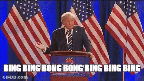 Donald Trump Is Giving A Speech At A Podium In Front Of American Flags GIF