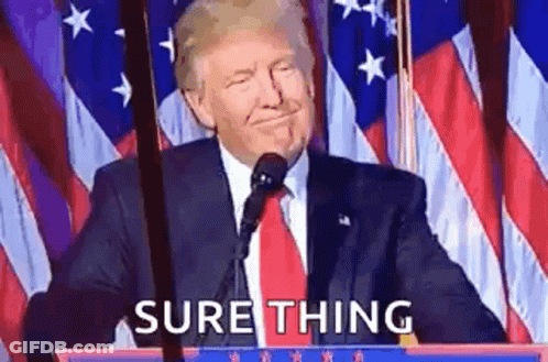 Donald Trump Is Giving A Speech At A Podium In Front Of An American Flag While Smiling . GIF