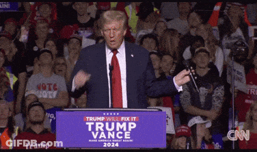 Donald Trump Is Giving A Speech At A Podium That Says Trump Will Fix It Trump Vance GIF