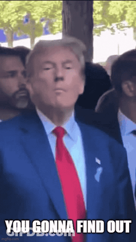 Donald Trump Is Wearing A Blue Suit And Red Tie And Is Standing In A Crowd . GIF