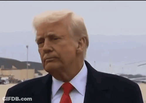 Donald Trump Is Wearing A Suit And Tie And Looking At Something GIF