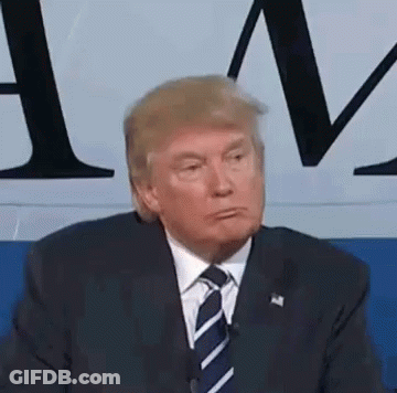 Donald Trump Is Wearing A Suit And Tie And Making A Funny Face While Sitting In Front Of A Microphone . GIF