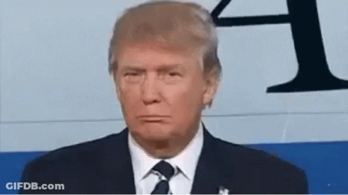 Donald Trump Is Wearing A Suit And Tie While Making A Funny Face . GIF