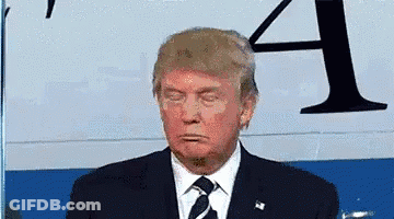 Donald Trump Is Wearing A Suit And Tie While Standing In Front Of A Sign That Says A . GIF