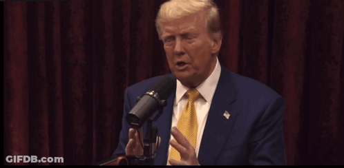 Donald Trump Speaking Into A Microphone With The Words He Goes He 'S A Stupid Son Of A Bitch Written In Yellow GIF