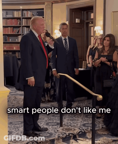 Donald Trump Speaking Into A Microphone With The Words Smart People Don 'T Like Me Behind Him GIF