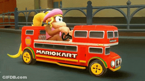Donkey Kong Is Driving A Red Double Decker Bus With Mariokart On The Side GIF