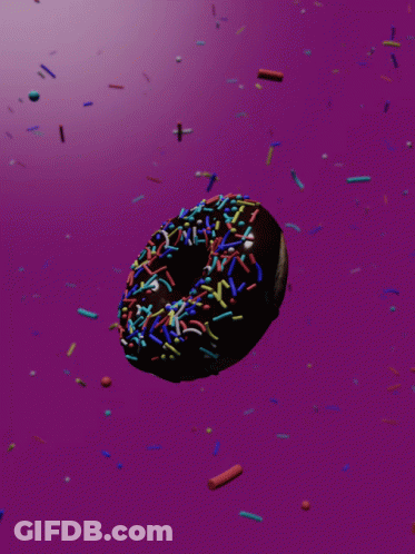 Donut With Chocolate Frosting And Sprinkles On Pink Background GIF