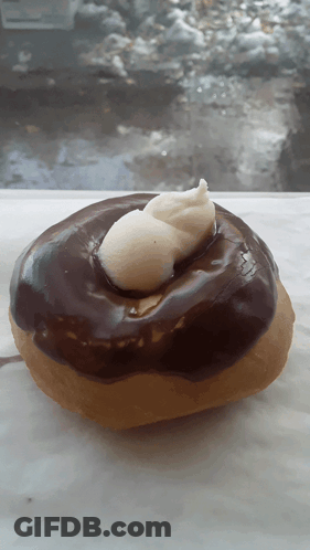 Donut With Chocolate Frosting And Whipped Cream GIF