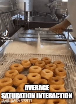 Donuts Being Cooked In Machine GIF