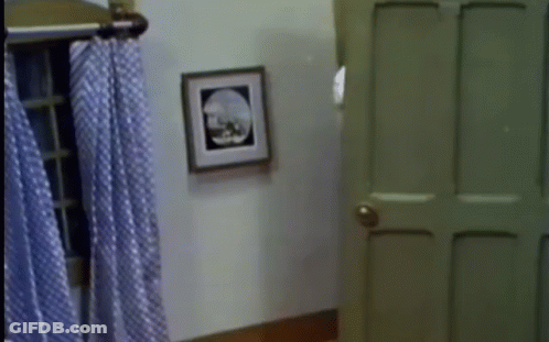 Door With Picture Behind GIF