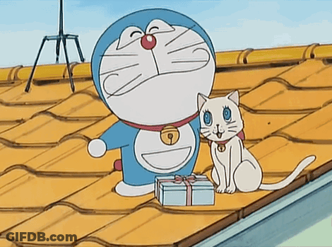 Doraemon And A White Cat Are On A Roof With A Gift Box GIF