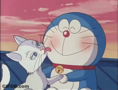 Doraemon Holding White Cat Licking Nose GIF