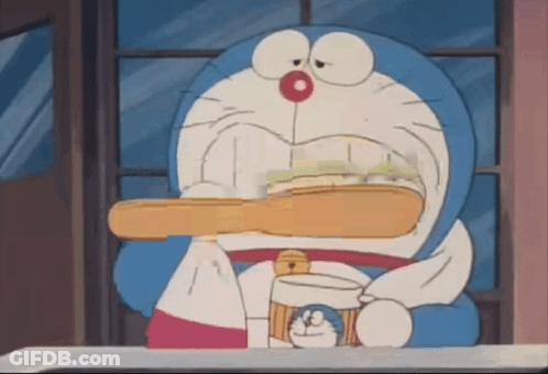 Doraemon Is Brushing His Teeth With A Toothbrush GIF