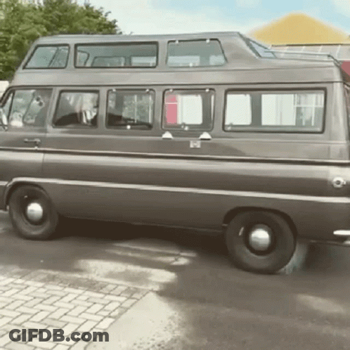 Double Decker Van Parked On Brick Driveway GIF