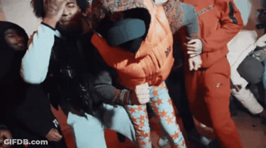 Dougie B Dance Move Wearing Orange Sweater GIF