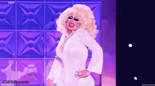 Drag Queen Dancing On Stage In White Dress GIF