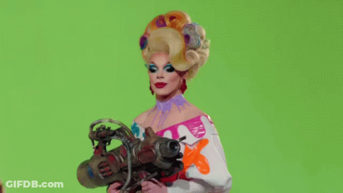 Drag Queen Holding Clapper Board Saying Rupaul GIF