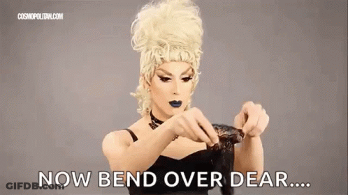 Drag Queen Holding Wig Saying Now Bend Over Dear GIF