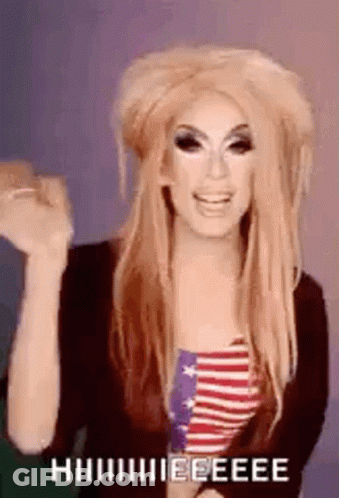 Drag Queen In American Flag Shirt With Hands Up And Funny Face GIF