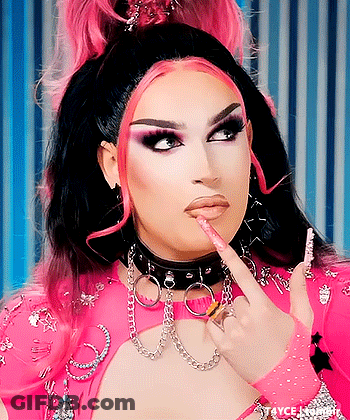 Drag Queen In Choker And Gloves Pointing At Lips GIF