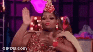 Drag Queen In Crown High-Fiving While Dancing GIF