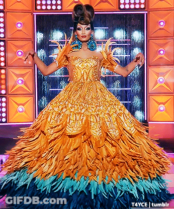 Drag Queen In Feathered Dress On Stage GIF