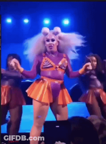 Drag Queen In Purple And Orange Outfit Performing GIF