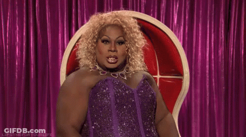 Drag Queen In Purple Dress Pointing GIF