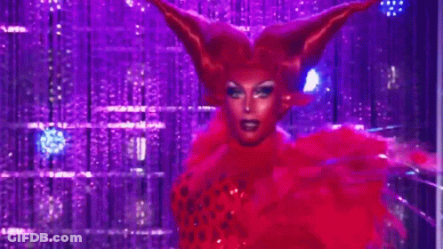 Drag Queen In Red Wig And Feathers GIF