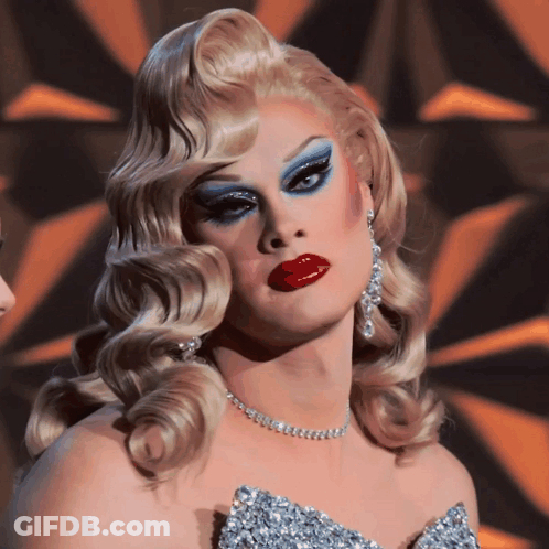 Drag Queen In Silver Dress And Necklace GIF