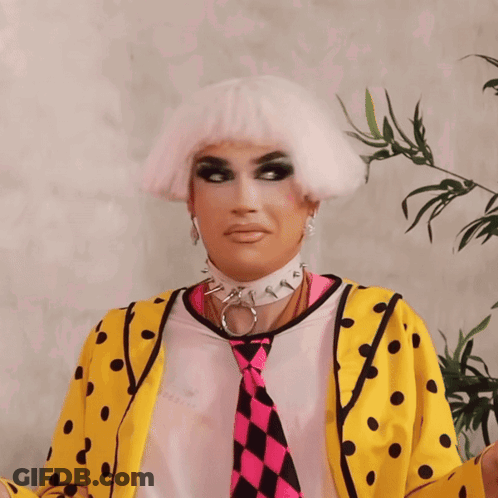 Drag Queen In Yellow And Pink Polka Dot Jacket GIF