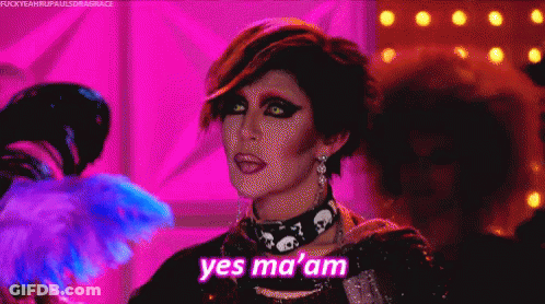 Drag Queen Saying Yes Ma Am With Fan GIF