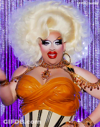 Drag Queen With Huge White Wig And Gold Corset GIF