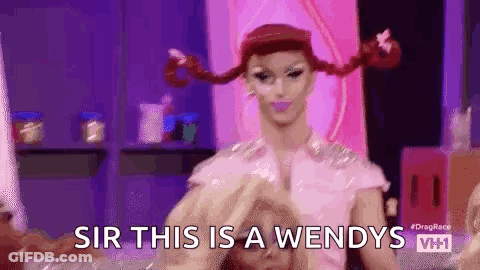 Drag Queen With Pigtails Making Heart Shape GIF