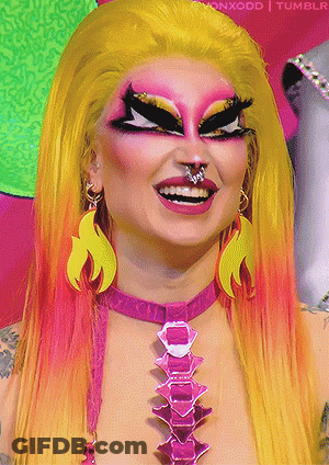 Drag Queen With Pink Necklace And Earrings GIF