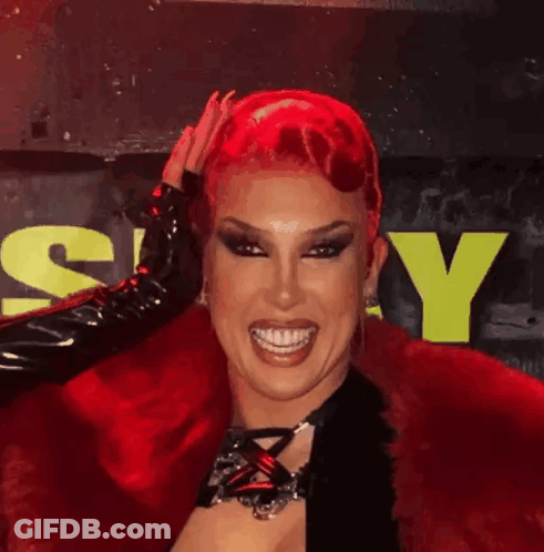Drag Queen With Red Hair And Black Gloves GIF