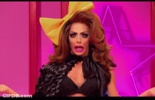 Drag Queen With Yellow Bow Making Funny Face GIF