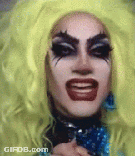 Drag Queen With Yellow Wig And Red Lips GIF
