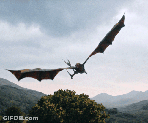 Dragon Flying Over Tree Through Cloudy Sky GIF